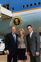 President George W. Bush met Kris Brown and Drucie Cole upon arrival in Houston, Texas, on Monday, March 8, 2004.  Brown, a kicker with the Houston Texans, volunteers each month with the Texas Children’s Hospital.  Cole also volunteers at the Texas Children’s Hospital visiting with patients each week.