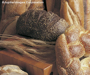 Photo:  Bread products and stalks of wheat