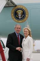 President George W. Bush presented the President’s Volunteer Service Award to Amber Davis-Collins upon arrival in Atlanta, Georgia, on Thursday, March 9, 2006.  Davis-Collins served two years in Honduras as a Peace Corps volunteer.  To thank them for making a difference in the lives of others, President Bush has met with more than 475 individuals around the country, like Davis-Collins, since March 2002.