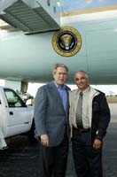 President George W. Bush met Candido Corona upon arrival in Tampa, Florida, on Sunday, February 15, 2004.  Corona has volunteered each year with Paint Your Heart Out Tampa since 1998.