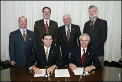 OSHA's then-Assistant Secretary, John Henshaw, and HPS members at national Alliance signing