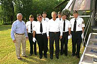 President George W. Bush met Bill Boyd, 71, Charlie Cavender, 69, John Lockhart, 68, LeRoy Sayre, 71, Stanley Shaffer, 47, and Donald Southall, 69, upon arrival in Ripley, West Virginia on July 4th. Each is a veteran, and together they are working as volunteers for a program to help drive veterans to medical appointments. 