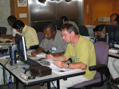 Meteorologists from the Caribbean region 
complete a practical exercise on the Dvorak
technique during the 2004 World Meteorological Organization (WMO) Regional
Association IV (RA-IV) Workshop on Hurricane Forecasting and Warning.
