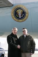 President George W. Bush presented the President’s Volunteer Service Award to T.J. Powell upon arrival in Cleveland, Ohio, on Thursday, January 27, 2005.  Powell, 38, is an active volunteer with the Northeast Ohio Medical Reserve Corps.  Medical Reserve Corps is a program partner of Citizen Corps, an important component of USA Freedom Corps.