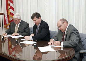 L-R: Kenny Jordan, AESC Executive Director; OSHA's then-Acting Assistant Secretary Jonathan L. Snare and Ken Gates, AESC President sign national Alliance on March 30, 2005.