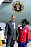 President George W. Bush met Annie Kaigler upon arrival in Detroit, Michigan, on Monday, August 30, 2004.  Kaigler, 74, is an active volunteer with Catholic Social Services of Wayne County through the Foster Grandparent program.