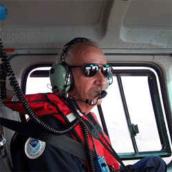NOAA SSC on board a helicopter.