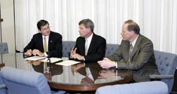 From L-R: OSHA's then-Assistant Secretary, John Henshaw with Dow's, Vice President, Environment, Health and Safety, David Graham, and Dow's Manager, North American Health and Safety Regulatory Affairs, Mark Spence, renew national Alliance May 26, 2004.