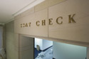 Bronze letters for the Coat Check