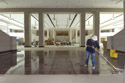 A worker in the Great Hall washes an area of marble floor