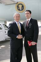 President George W. Bush presented the President’s Volunteer Service Award to Patrick Gilligan upon arrival at the airport in New York, New York, on Monday, September 18, 2006.  Gilligan is a volunteer with New York Cares.  To thank them for making a difference in the lives of others, President Bush honors a local volunteer, called a USA Freedom Corps Greeter, when he travels throughout the United States.  President Bush has met with more than 500 individuals around the country, like Gilligan, since March 2002.