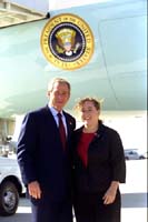 President George W. Bush met Jill Sieder upon arrival in Atlanta, Georgia, on Thursday, October 17, 2002. Sieder is the founder and coordinator of the East Atlanta Kids Club, a nonprofit mentoring and enrichment program for children ages 7 to 12. 