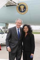 President George W. Bush presented the President’s Volunteer Service Award to Anjana Chandran, 17, upon arrival at the airport in Des Moines, Iowa, on Tuesday, April 11, 2006.  Chandran, a senior at Valley High School, is a volunteer at Iowa Methodist Medical Center and Blank Children’s Hospital.  To thank them for making a difference in the lives of others, President Bush has met with more than 480 individuals around the country, like Chandran, since March 2002.