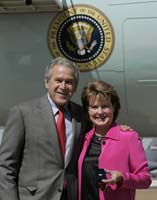 President George W. Bush presented the President’s Volunteer Service Award to Linda Smith upon arrival at the airport in Memphis, Tennessee, on Wednesday, September 27, 2006.  Smith is a volunteer with Service Over Self, the Lester Community Center and Lester School.  To thank them for making a difference in the lives of others, President Bush honors a local volunteer, called a USA Freedom Corps Greeter, when he travels throughout the United States.  President Bush has met with more than 500 individuals around the country, like Smith, since March 2002.