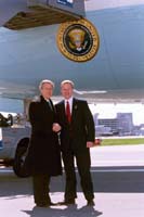 President George W. Bush met John H. Susanin upon arrival in Philadelphia, Pennsylvania, on Monday, March 31, 2003. Susanin has volunteered with the American Red Cross for the past 13 years.