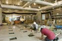 Masons set floor stone in the lobby area just outside of the CVC's two Orientation Theaters