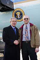 President George W. Bush met Bruce Vanisacker upon arrival in Toledo, Ohio, on Wednesday, January 21, 2004.  Vanisacker has been an active volunteer with FIRST (For Inspiration and Recognition of Science and Technology) Robotics since 1999.