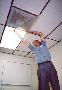 Figure 1. Person taping plastic sheeting over a vent to close airflow. Caption: Tape plastic sheeting over vents, windows, and doors to prevent contaminated air from entering the room.- Copyright WARNING: Not all materials on this Web site were created by the federal government. Some content — including both images and text — may be the copyrighted property of others and used by the DOL under a license. Such content generally is accompanied by a copyright notice. It is your responsibility to obtain any necessary permission from the owner's of such material prior to making use of it. You may contact the DOL for details on specific content, but we cannot guarantee the copyright status of such items. Please consult the U.S.Copyright Office at the Library of Congress — http://www.copyright.gov — to search for copyrighted materials.
