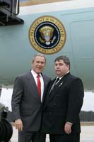 President George W. Bush presented the President’s Volunteer Service Award to Steve Miller upon arrival in Jacksonville, Florida, on Friday, January 14, 2005.  Miller, 41, is an active volunteer mentor for the Jacksonville Early College High School (JECHS) program.