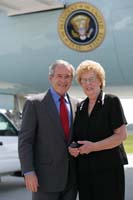 President George W. Bush presented the President’s Volunteer Service Award to Marion Jones upon arrival in Charleston, South Carolina, on Tuesday, July 24, 2007.  Jones is a volunteer with the Airman and Family Readiness Center at Charleston Air Force Base.  To thank them for making a difference in the lives of others, President Bush honors a local volunteer when he travels throughout the United States.  President Bush has met with more than 575 individuals around the country, like Jones, since March 2002.