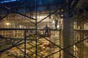 Workers inside the Great Hall prepare to raise a sandstone block