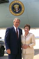 President George W. Bush met Connie Melton upon arrival in Little Rock, Arkansas, on Thursday, August 29, 2002. Melton is founder of the Arkansas Dress for Success affiliate, a not-for-profit organization that provides low-income women trying to enter the work force with suits and clothing appropriate for job interviews. Melton, a graduate of Parkview High School (renamed Parkview Arts & Science Magnet School), will also join President Bush when he delivers remarks on education at the school later that day. 