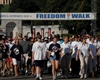Walkers leave the Women in Military Service for America Memorial at Arlington National Cemetary during the America Supports You Freedom Walk in Washington, D.C., Sept. 7, 2008. Thousands of walkers joined in the national walk, which went from Arlington to the crash site at the Pentagon. 