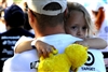 A father carries his daughter and Big Bird during the end of the America Supports You Freedom Walk in Washington, D.C., Sept. 7, 2008. Thousands of walkers joined in the national walk, which went from the Women in Military Service for America Memorial at Arlington National Cemetery to the crash site at the Pentagon. 