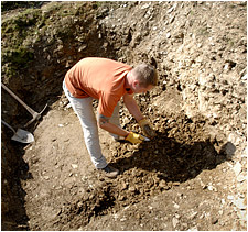 Army Sgt. Jared Michalek, a JPAC recovery team noncommissioned officer, looks for any pieces of evidence that can help identify a missing servicemember recovered at a site in Germany. Defense Dept. photo by Fred W. Baker III