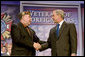 President George W. Bush shakes hands with Veterans of Foreign Wars National Commander Gary Kurpius following the President's address Wednesday, Aug. 22, 2007, to the Veterans of Foreign Wars National Convention in Kansas City, Mo. White House photo by Chris Greenberg