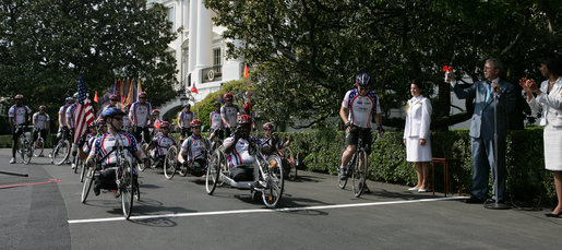 President George W. Bush sounds the horn to kick off the Wounded Warriors Soldier Ride Thursday, April 24, 2008, on the South Lawn drive at the White House. With him is Secretary of State Condoleezza Rice. White House photo by Chris Greenberg