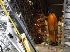 The space shuttle Atlantis is lifted inside the Vehicle Assembly Building.