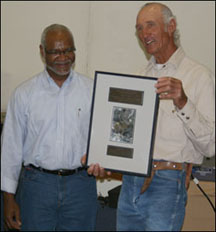 Dr Tuggle presents Warner Glenn with an award for his efforts of regional recovery of the jaguar and borderlands.