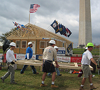 Volunteers prepare for a day's work in front of the Nation's House.