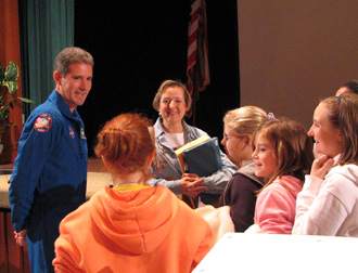 Astronaut Michael Good and students