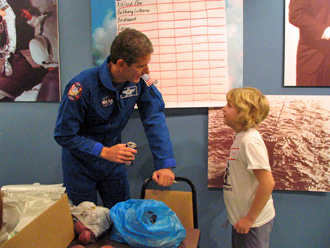 Astronaut Michael Good talks to Young Astronaut Day participant
