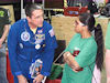 Astronaut Don Thomas chats with students and signs autographs