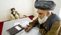 An official at the Kandahar Court, takes notes as Ghulam Rasool, left, tells the story of how his home came to be occupied by another family while he was living as a refugee during Taliban rule Sept., 2002 in Kandahar, Afghanistan. (AP Photo/Ed Wray)