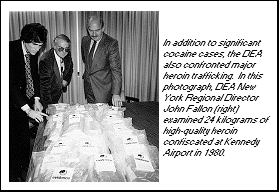 In this photo, DEA New York Regional Director John Fallon examined 24 kilograms of high-quality heroin confiscated at Kennedy Airport in 1980.