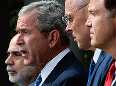 President Bush, flanked by Federal Reserve Chairman Ben Bernanke (left) Treasury Secretary Henry Paulson, and SEC Chairman Christopher Cox, delivers a statement about the economy and government efforts to remedy the crisis, Sept. 19, 2008. Credit: Win McNamee/Getty Images.