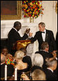 President George W. Bush and President John Agyekum Kufuor of Ghana tip their glasses in a toast during a White House State Dinner Monday, Sept. 15, 2008, in honor of President Kufuor and Mrs. Theresa Kufuor. White House photo by Eric Draper