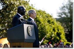 President George W. Bush stands with President John Agyekum Kufuor of Ghana Monday, Sept. 15, 2008, during a South Lawn Arrival Ceremony for the African leader at the White House. White House photo by David Bohrer