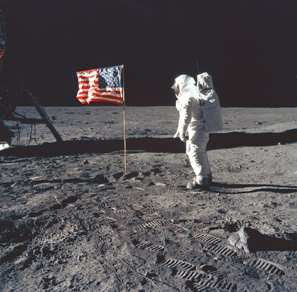 Aldrin poses with flag