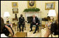 President George W. Bush and President John Agyekum Kufuor of Ghana pause for photos in the Oval Office prior to their meeting Monday, Sept. 15, 2008, at the White House. White House photo by Eric Draper