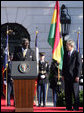 President George W. Bush smiles as President John Agyekum Kufuor of Ghana delivers remarks Monday, Sept. 15, 2008, during the South Lawn Arrival Ceremony for President Kufuor and Mrs. Theresa Kufuor of Ghana on the South Lawn of the White House. White House photo by Chris Greenberg