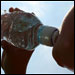 Photo: A person drinking bottled water
