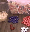 Containers of multi-colored beads for use with learning activity