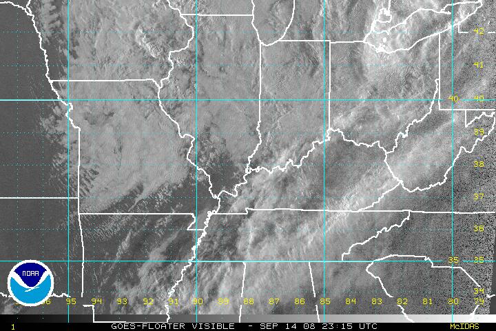 A recent visible image from GOES-12, zoomed in over a tropical disturbance.  Click on the image for a larger view.