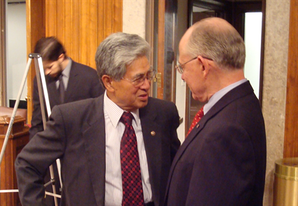 Veterans' Affairs Committee Chairman Akaka talks with Dr. James Peake before his nomination hearing to be Secretary of Veterans Affairs on Dec. 5