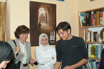 Photo of Palestinian students check out the new library at the Global Connections Internet Learning Center in Hebron.